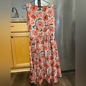 Beautiful floral dress worn for a wedding once, been hanging in my closet since.